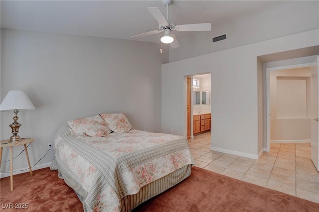 bedroom with light tile patterned floors, visible vents, light carpet, and baseboards