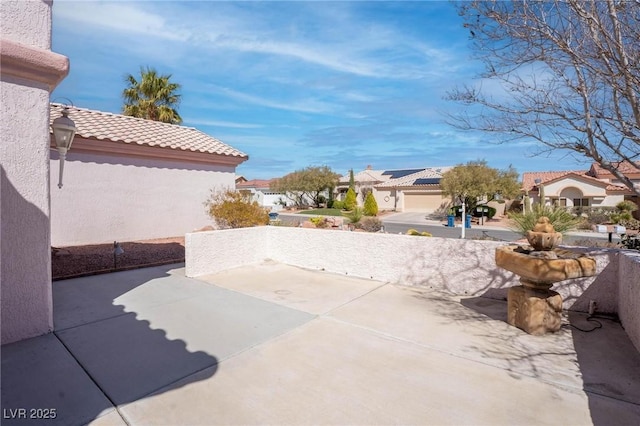 view of patio with a residential view