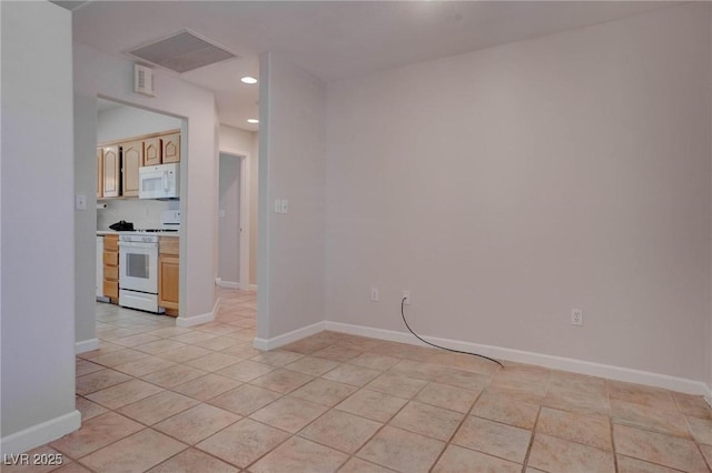 spare room with visible vents, recessed lighting, and baseboards