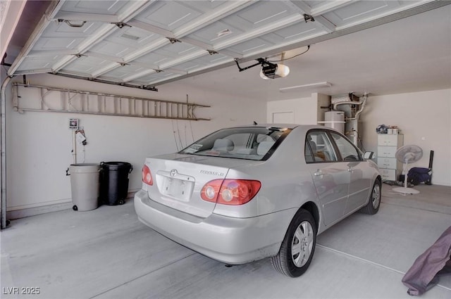 garage with a garage door opener and water heater