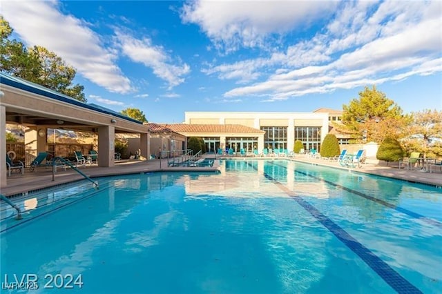 community pool with a patio area