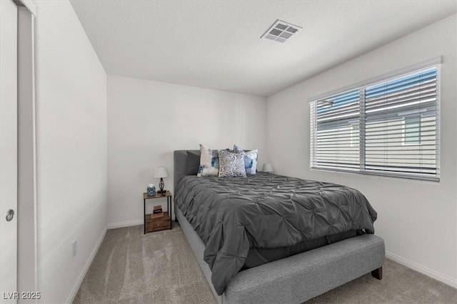 bedroom featuring visible vents, baseboards, and carpet flooring