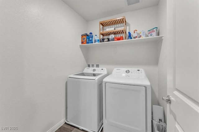 laundry room featuring laundry area, independent washer and dryer, and baseboards