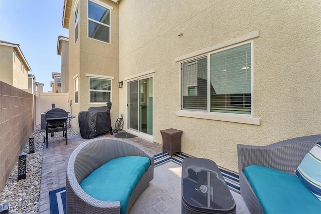 view of patio / terrace featuring a fenced backyard and a grill