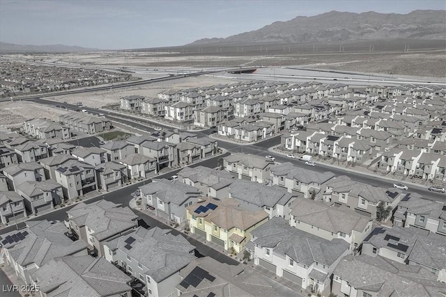 aerial view featuring a mountain view and a residential view