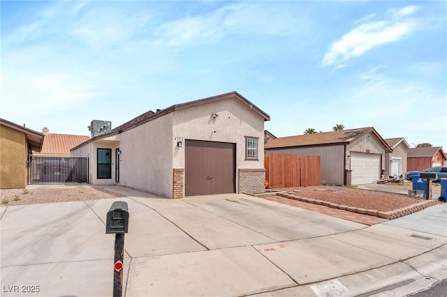 4153 Broadriver Dr, Las Vegas, NV 89108 - ranch-style home featuring a garage, stucco siding, concrete driveway, and fence