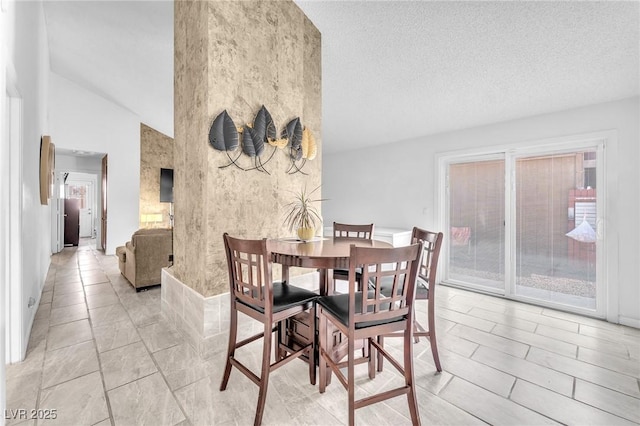 4153 Broadriver Dr, Las Vegas, NV 89108 - dining area featuring high vaulted ceiling, a textured ceiling, and light tile patterned floors