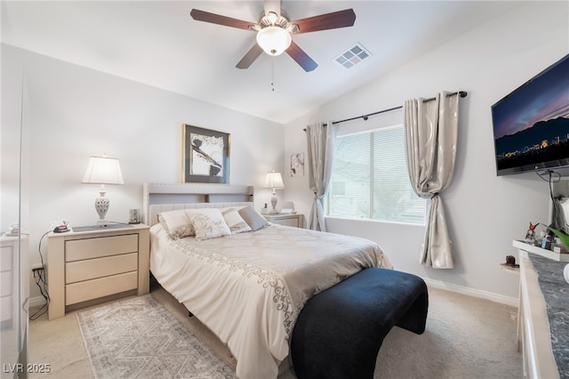 bedroom with visible vents, ceiling fan, baseboards, vaulted ceiling, and light carpet