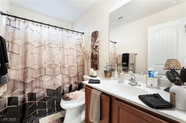 bathroom featuring visible vents, curtained shower, toilet, and vanity