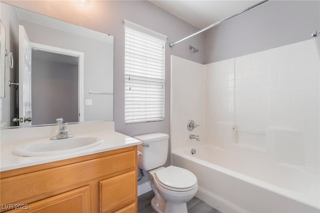 full bathroom with toilet, vanity, and  shower combination