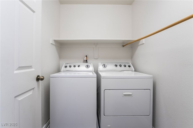 clothes washing area with laundry area and independent washer and dryer