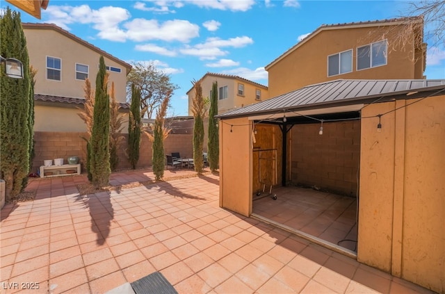 view of patio / terrace featuring fence