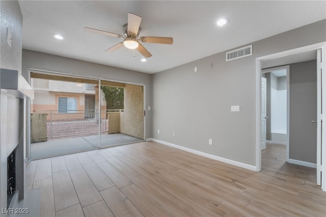 unfurnished bedroom with light wood-style flooring, recessed lighting, baseboards, and visible vents