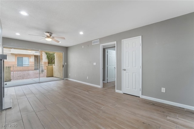 unfurnished room featuring baseboards, visible vents, recessed lighting, ceiling fan, and light wood-type flooring