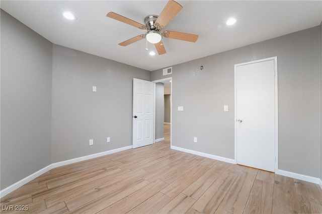 spare room featuring visible vents, recessed lighting, light wood finished floors, baseboards, and ceiling fan