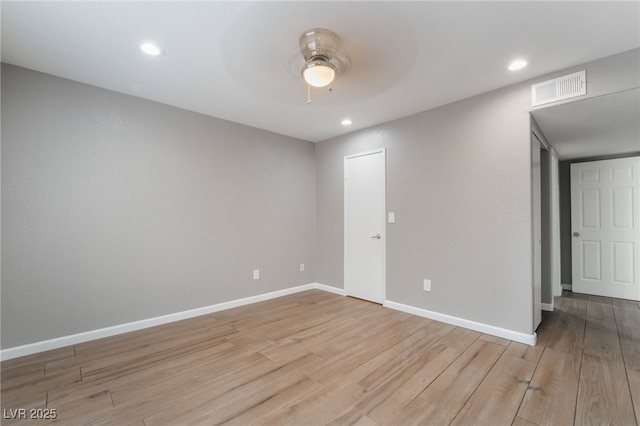 unfurnished room with visible vents, baseboards, recessed lighting, light wood-style flooring, and a ceiling fan