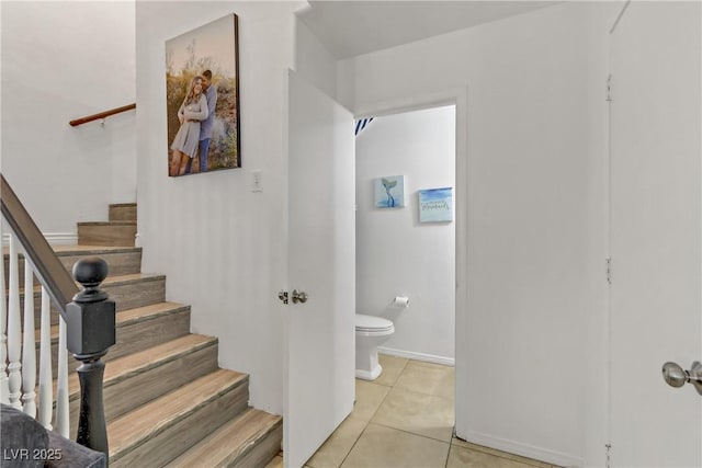 staircase with tile patterned floors