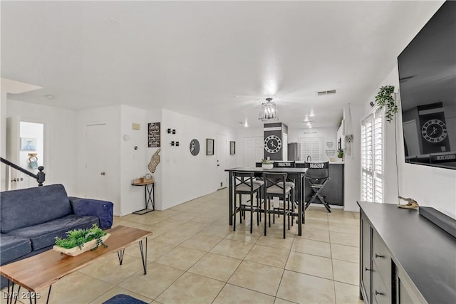 dining room with light tile patterned flooring and visible vents