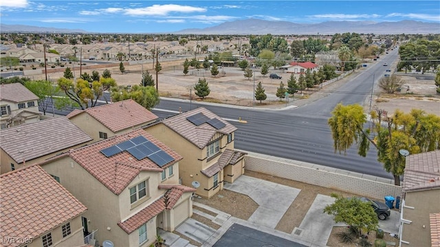 drone / aerial view with a residential view and a mountain view