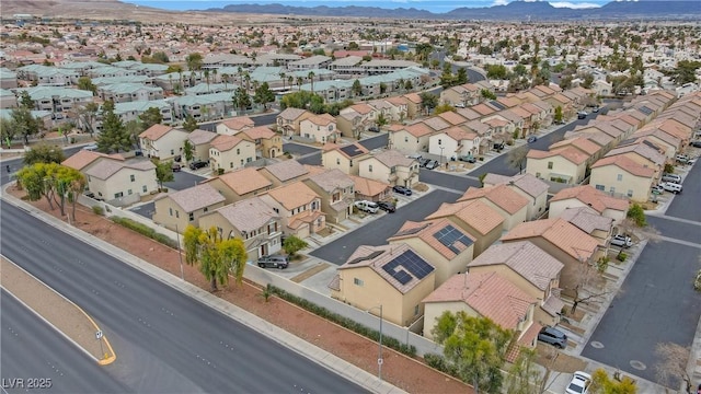 birds eye view of property with a mountain view and a residential view