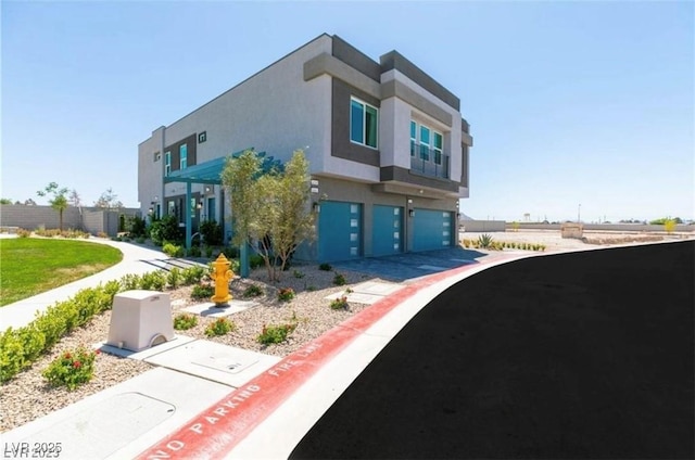 view of front of property featuring stucco siding and an attached garage