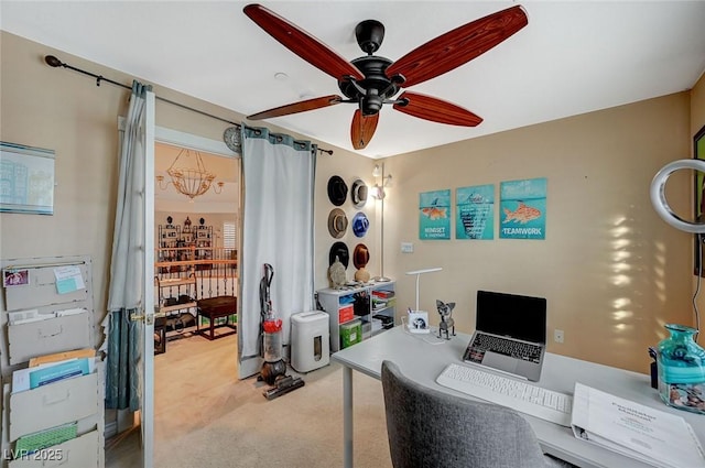 home office with light colored carpet and a ceiling fan