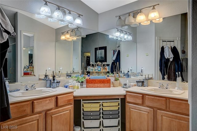 full bath with two vanities and a sink