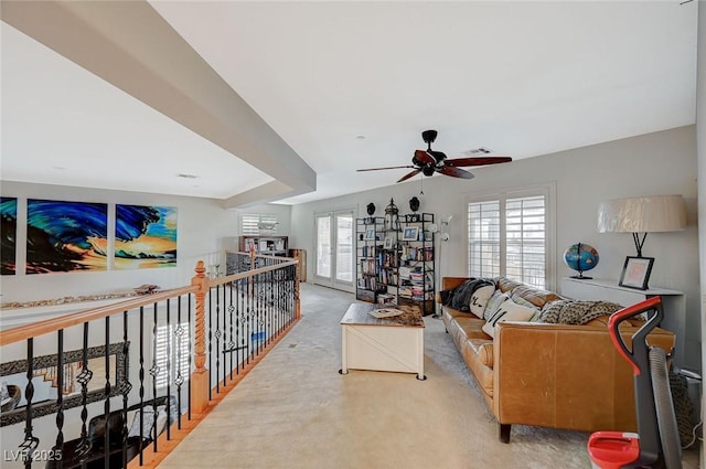 living area with carpet flooring, a ceiling fan, visible vents, and french doors