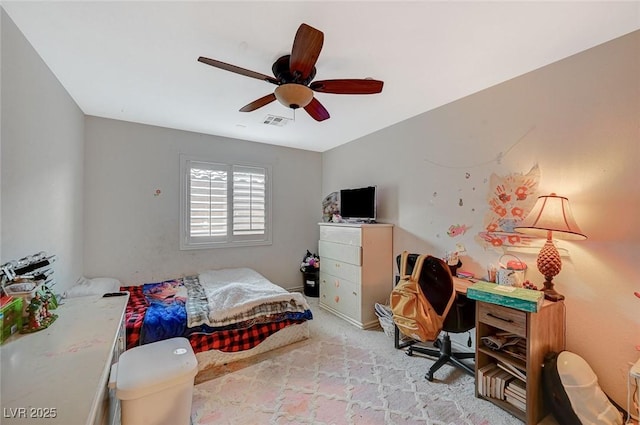 carpeted bedroom featuring visible vents and a ceiling fan