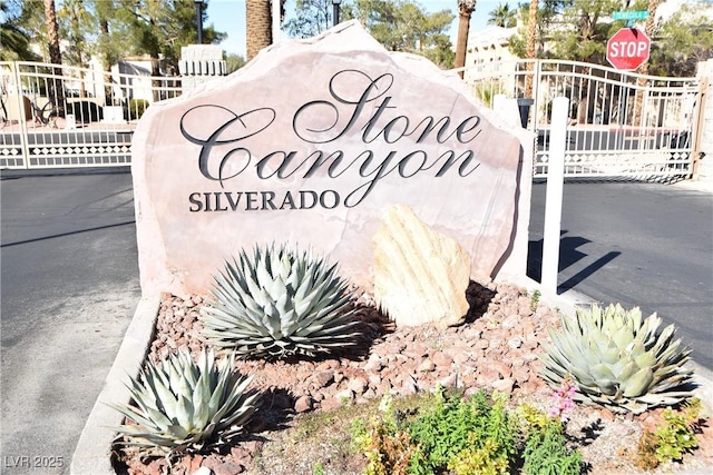 community sign with a gate and fence