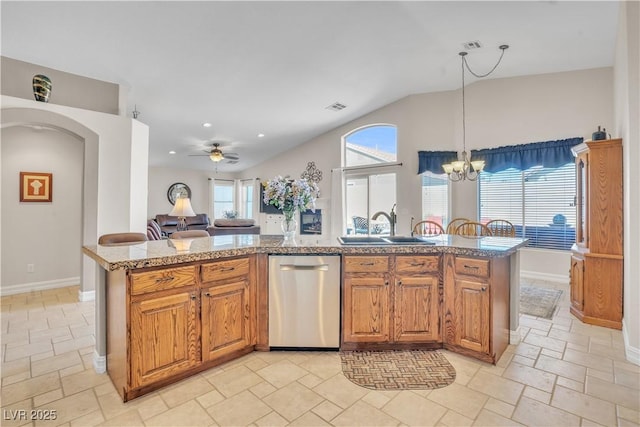 kitchen with brown cabinets, a sink, hanging light fixtures, dishwasher, and open floor plan