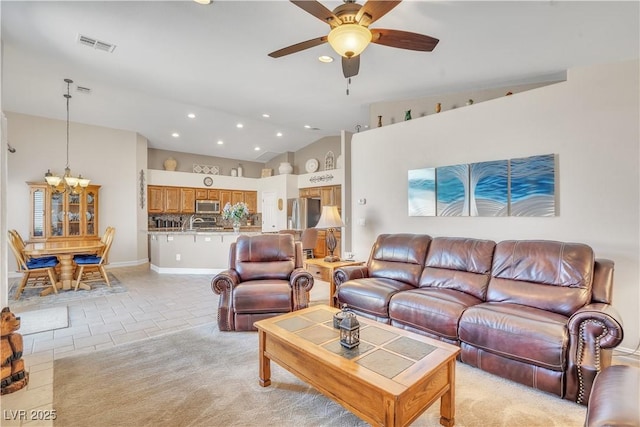 living area featuring light tile patterned floors, visible vents, lofted ceiling, recessed lighting, and ceiling fan with notable chandelier