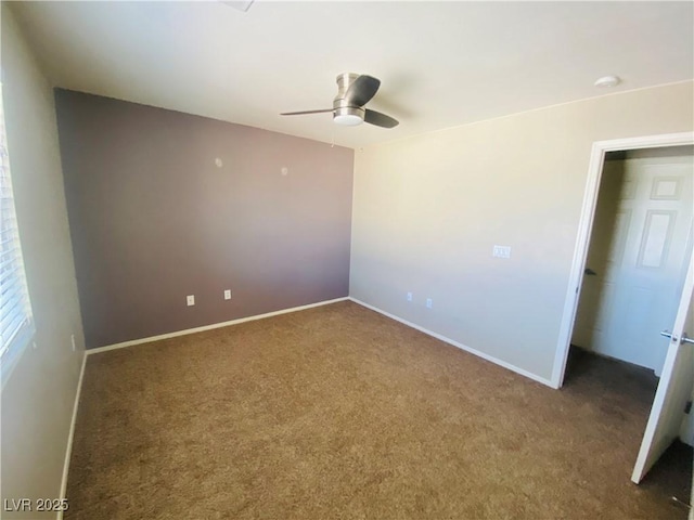 unfurnished bedroom with carpet flooring, a ceiling fan, and baseboards