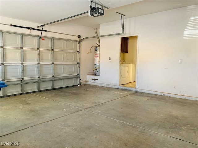 garage with water heater, washing machine and dryer, a garage door opener, and baseboards