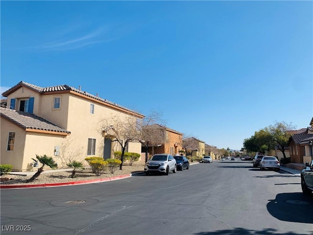 view of road featuring curbs and a residential view