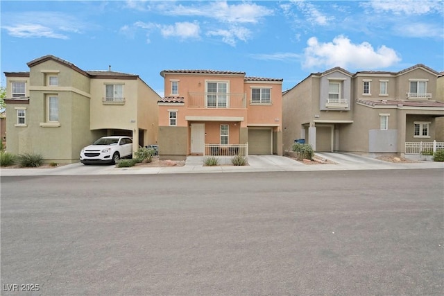 view of front facade with a residential view, stucco siding, concrete driveway, and a garage