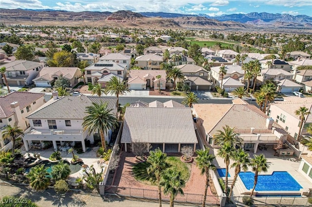 birds eye view of property featuring a mountain view and a residential view