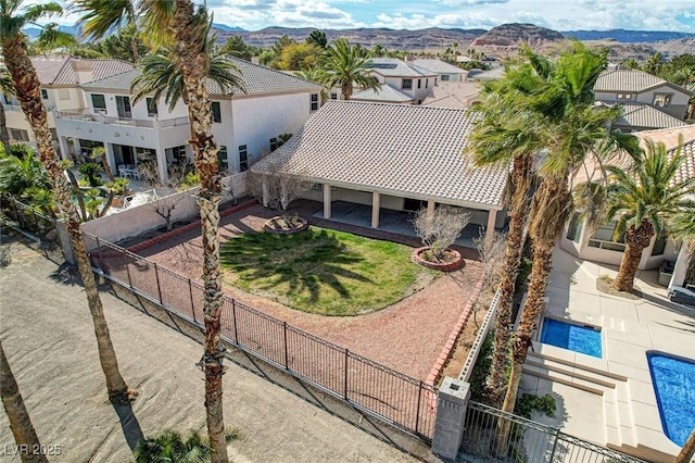 birds eye view of property with a residential view and a mountain view