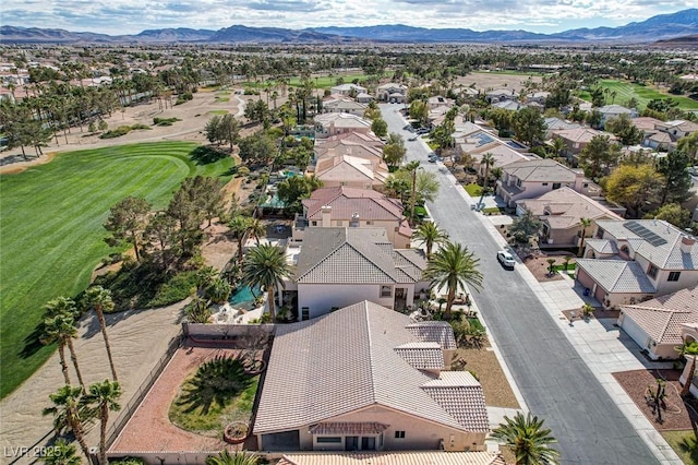 drone / aerial view featuring a residential view and a mountain view