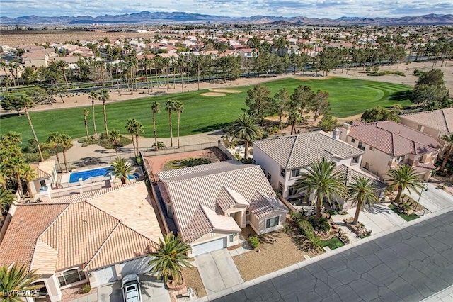 bird's eye view featuring a mountain view, a residential view, and golf course view