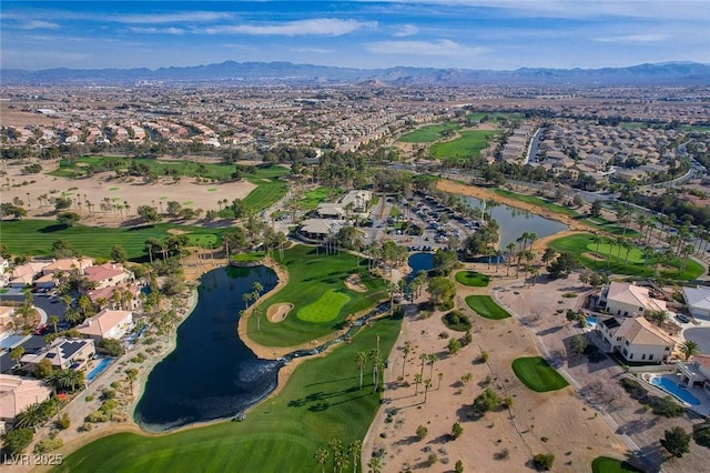 birds eye view of property featuring a residential view, a water and mountain view, and view of golf course