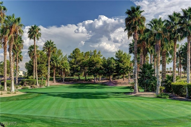 view of home's community with a yard and golf course view