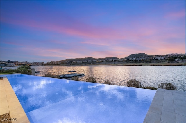 view of pool featuring a water and mountain view