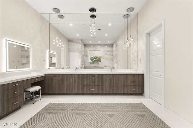 full bath featuring a sink, recessed lighting, walk in shower, and double vanity