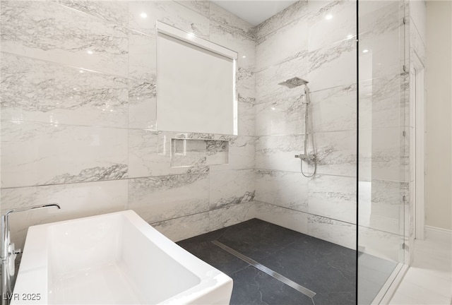 bathroom with a sink, a soaking tub, and tiled shower