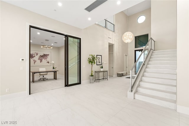 staircase featuring recessed lighting, baseboards, and an inviting chandelier