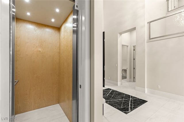 room details with elevator, recessed lighting, and baseboards