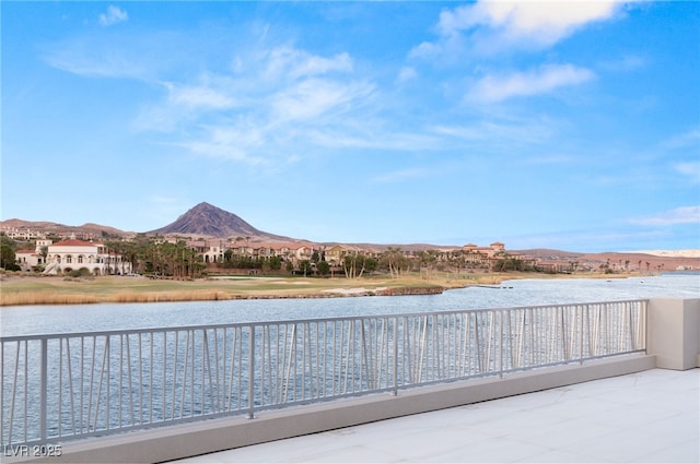 exterior space with a balcony and a water view