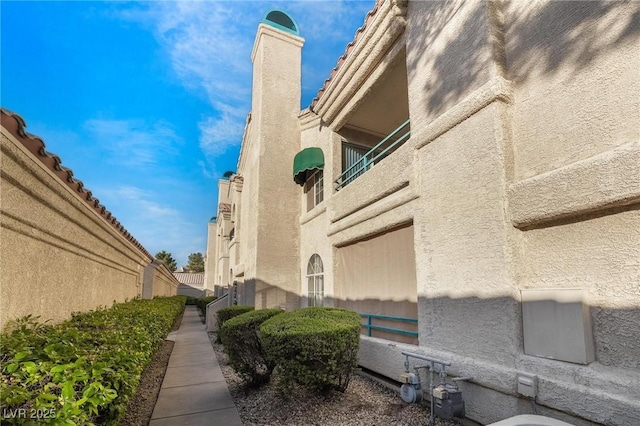 view of building exterior with fence