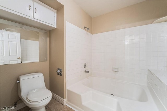 full bath with tile patterned floors, baseboards, toilet, and washtub / shower combination